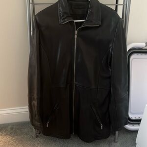 Leather jacket with zipper and zippered pockets